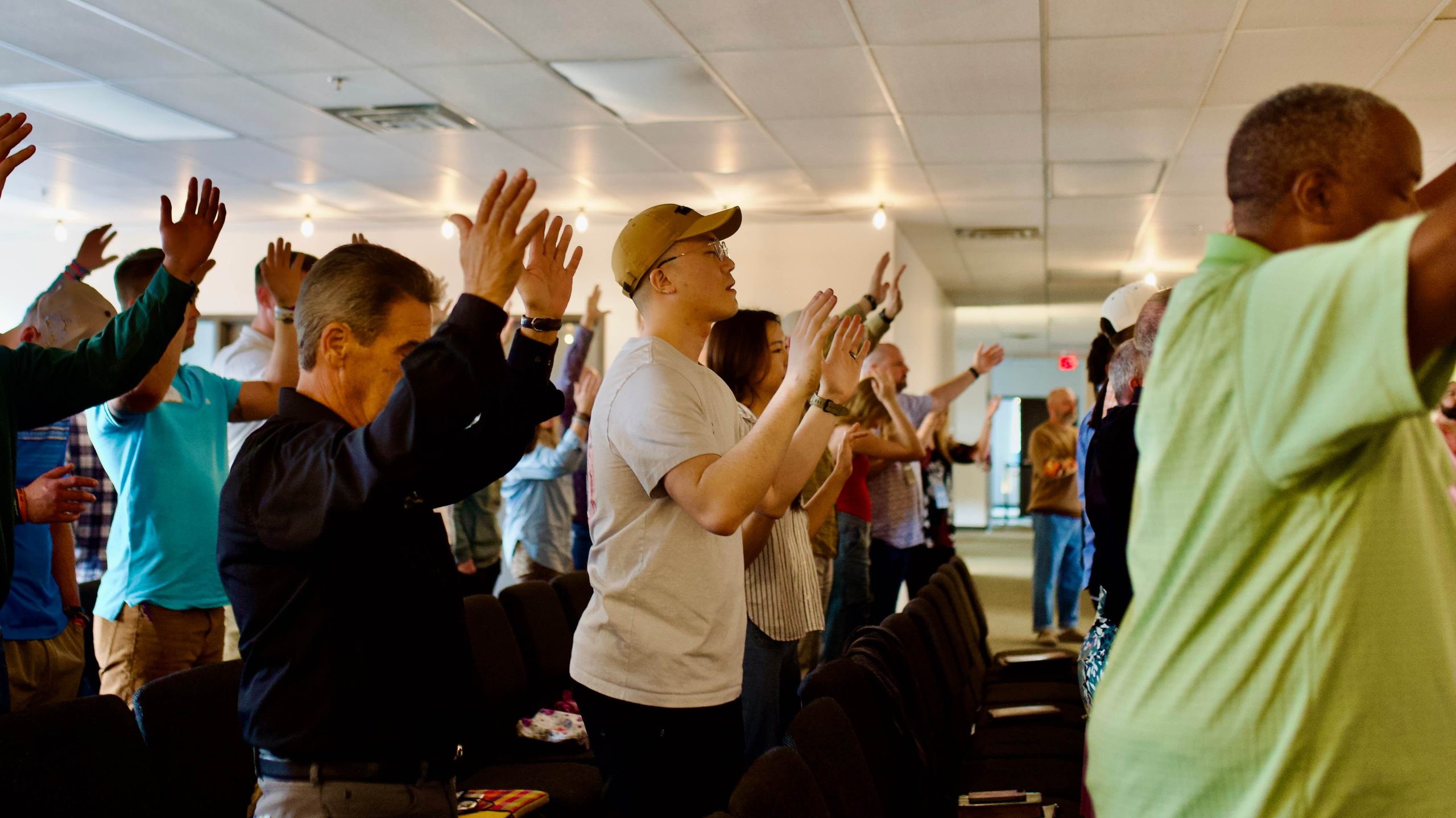 People worshipping at Nations House of Prayer Foundations Meeting