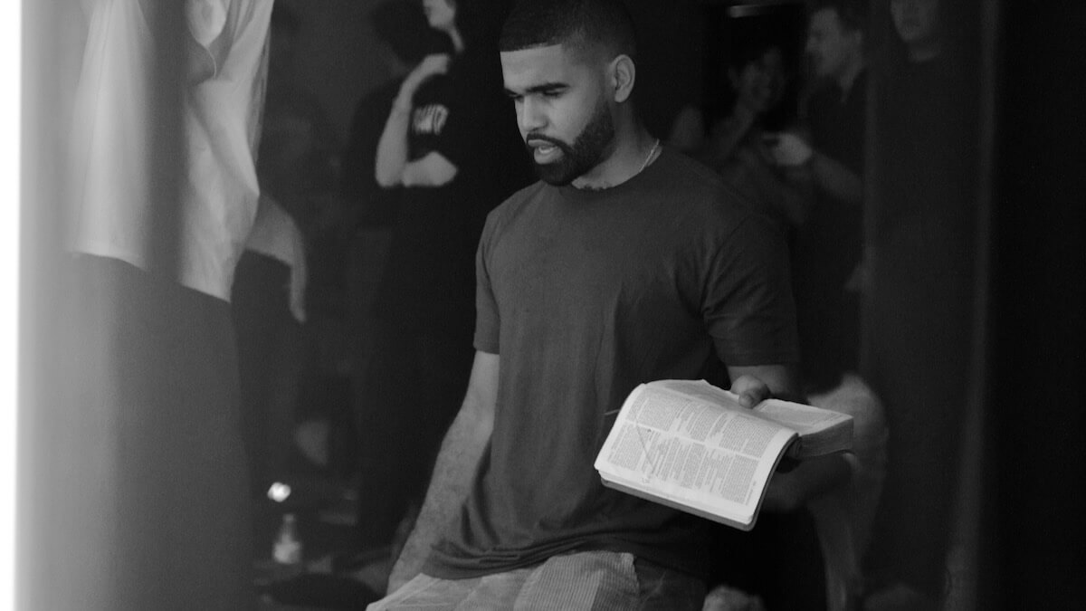 A young man on his knees in worship at Nations House of Prayer